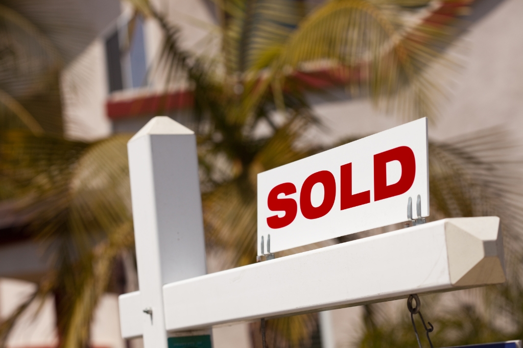 sold sign near the house sold sign near the house
